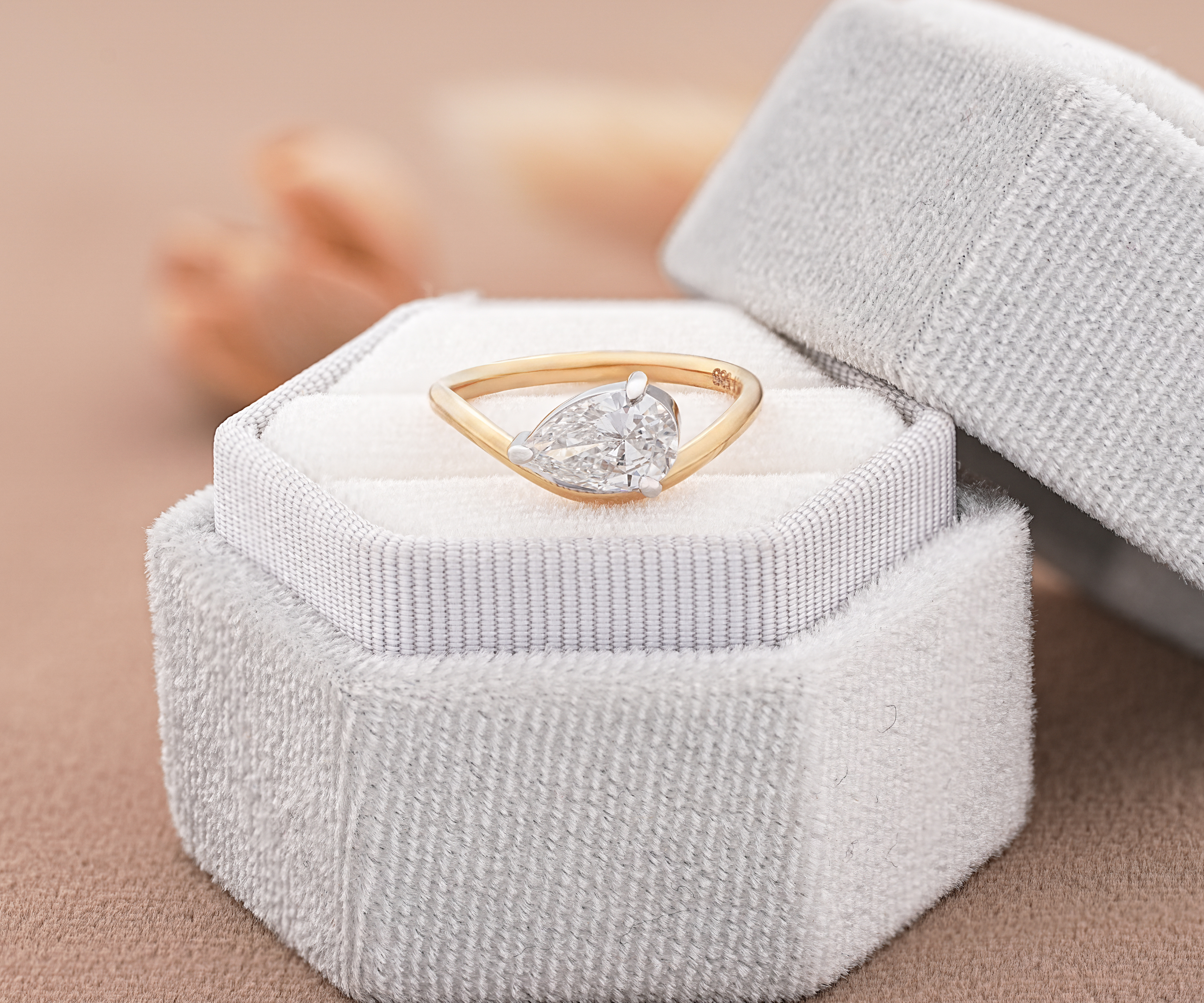 Gold ring with a pear-shaped diamond