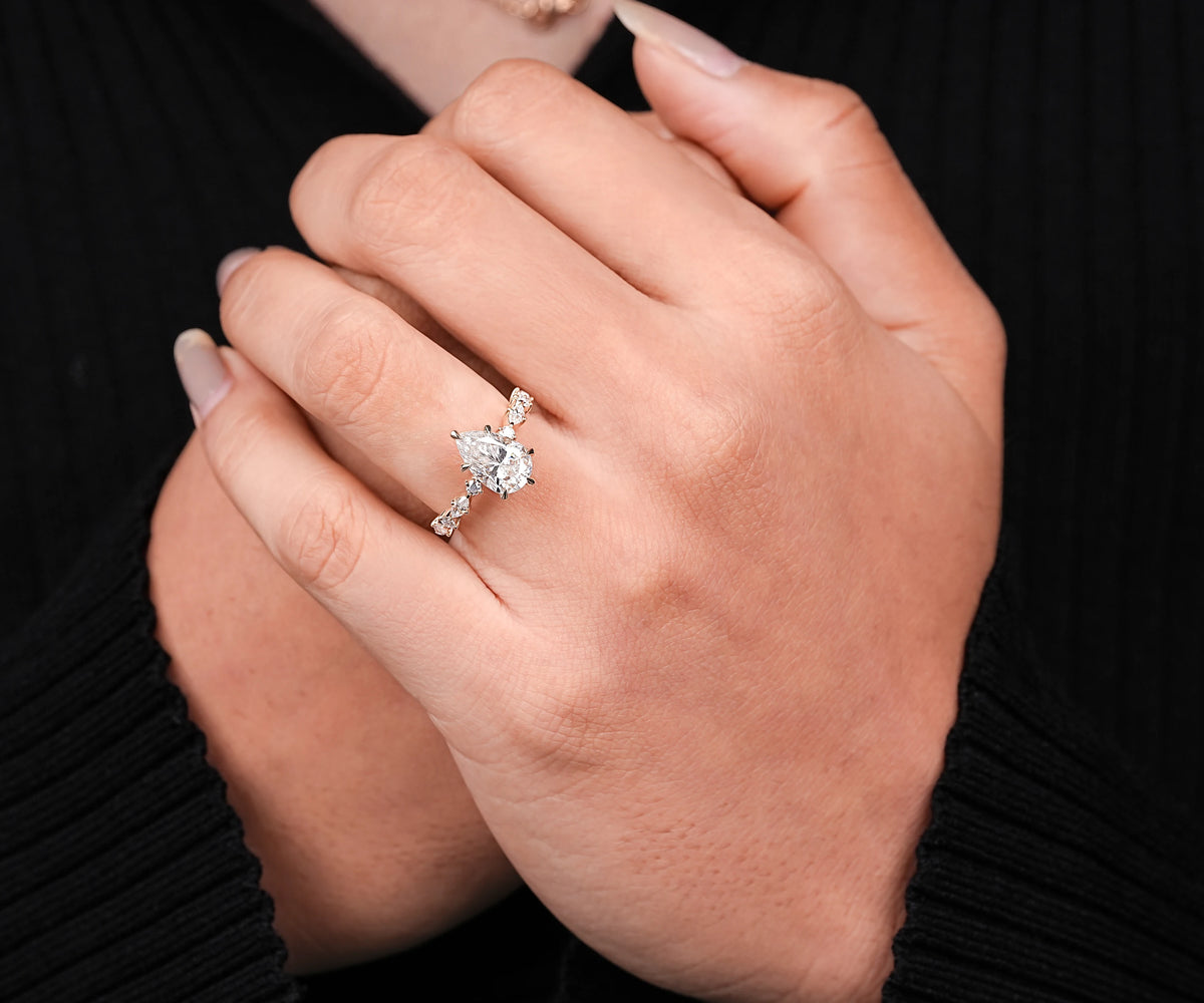 Lab grown pear cut diamond ring with accent stones