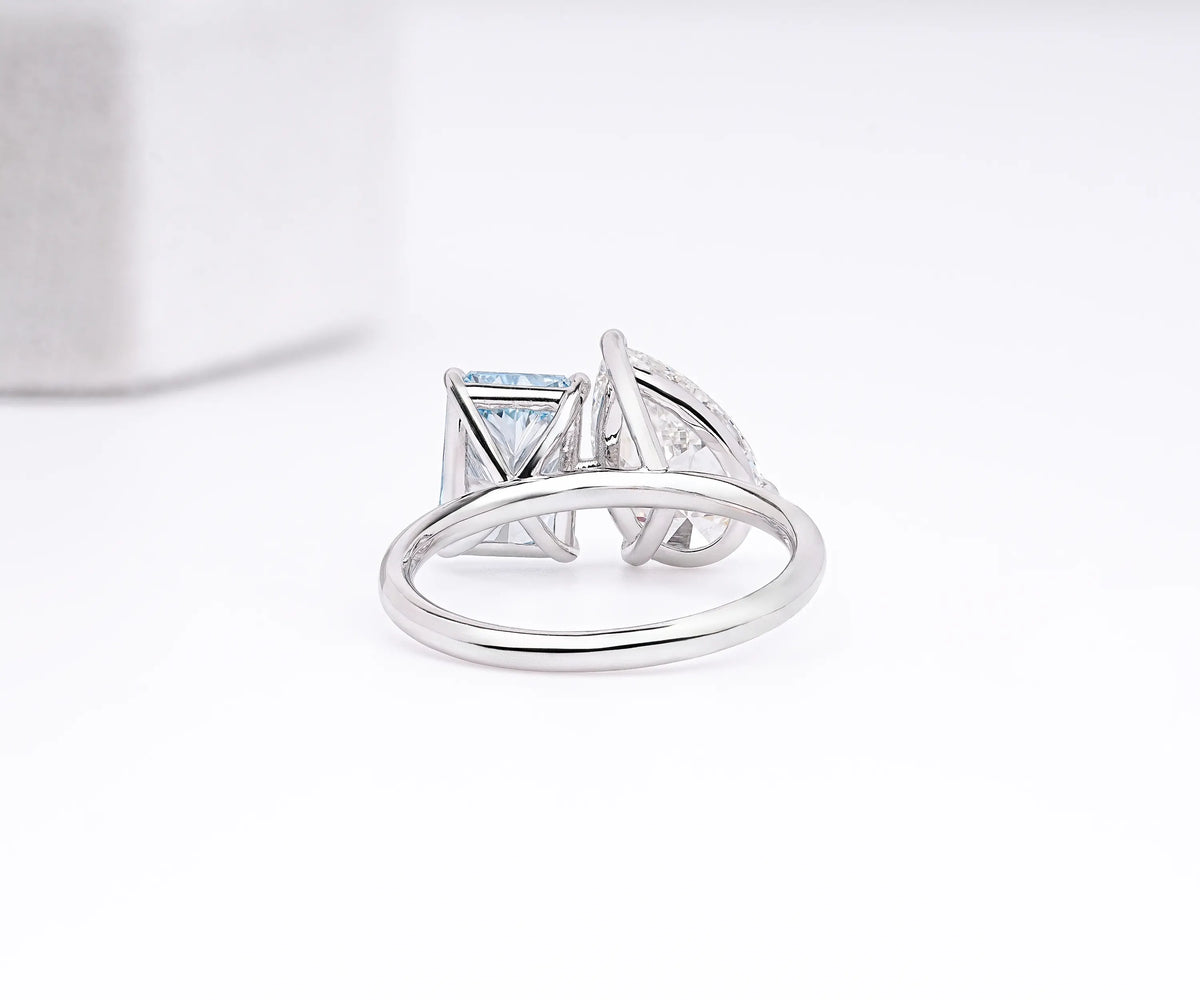 Pear and radiant cut lab diamond toi et moi engagement ring