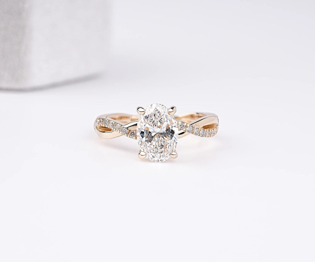 Hidden halo twist oval lab grown diamond engagement ring
