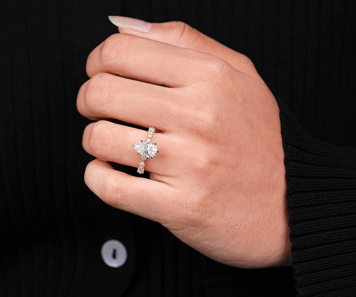 Lab grown pear diamond solitaire ring with side accents