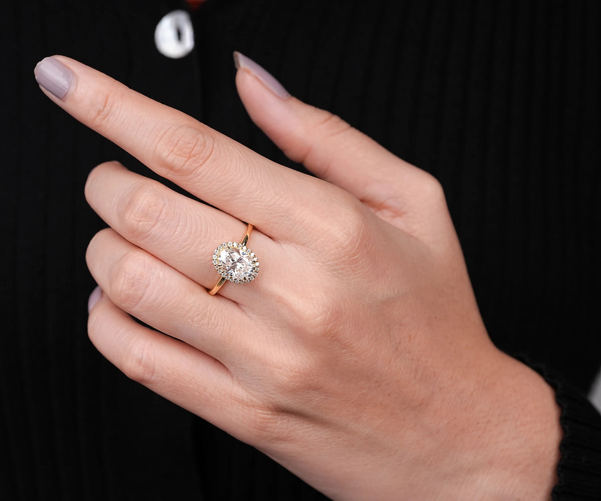 Oval cut lab diamond brilliant halo engagement ring