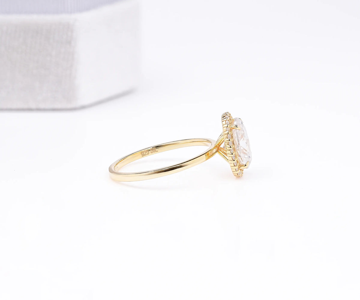 Oval lab grown diamond accent halo bridal ring