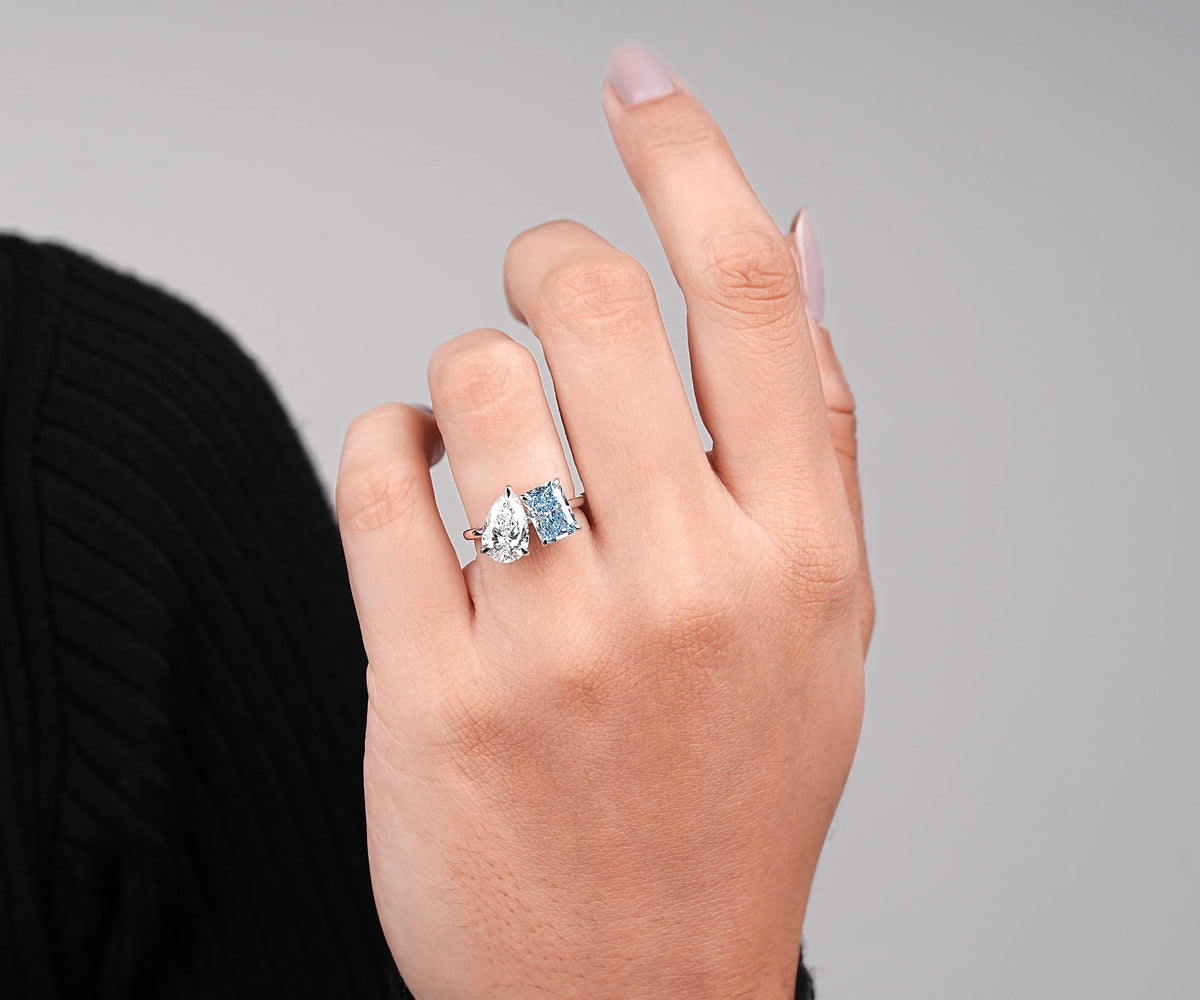 Pear cut and radiant cut lab grown diamond engagement ring